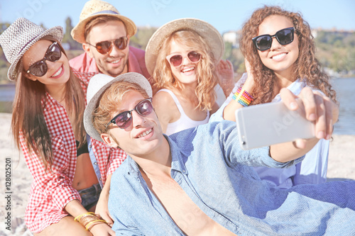 Happy friends taking selfie...