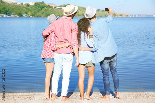 Happy friends taking selfie...