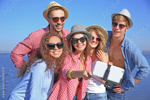 Happy friends taking selfie...