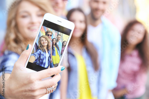 Happy friends taking selfie...