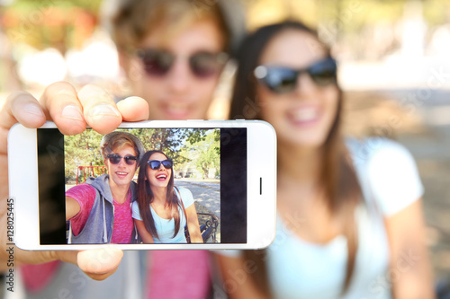 Happy couple taking selfie ...