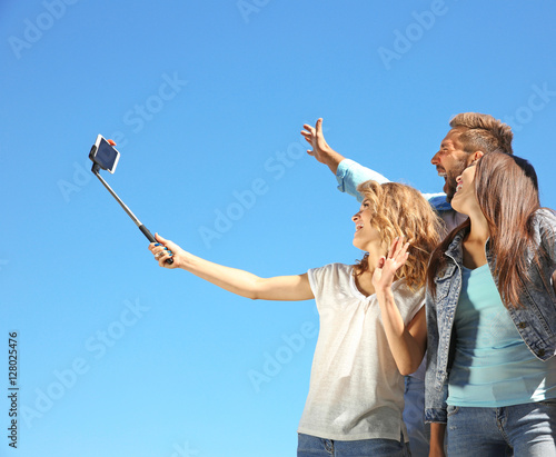 Happy friends taking selfie...