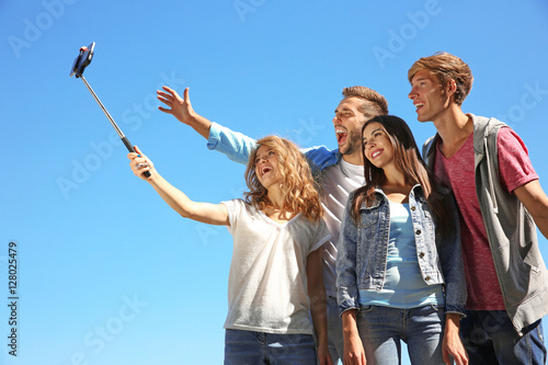Happy friends taking selfie...