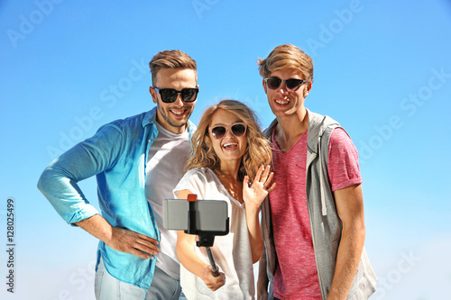 Happy friends taking selfie...