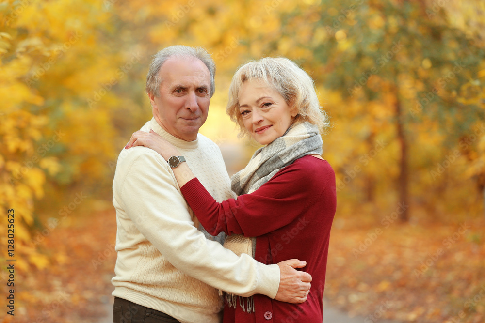 Lovely mature couple in autumn park