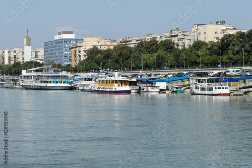 Row of cruise ships on the river shore