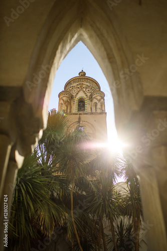 Look from below at tower illuminated with sunlight