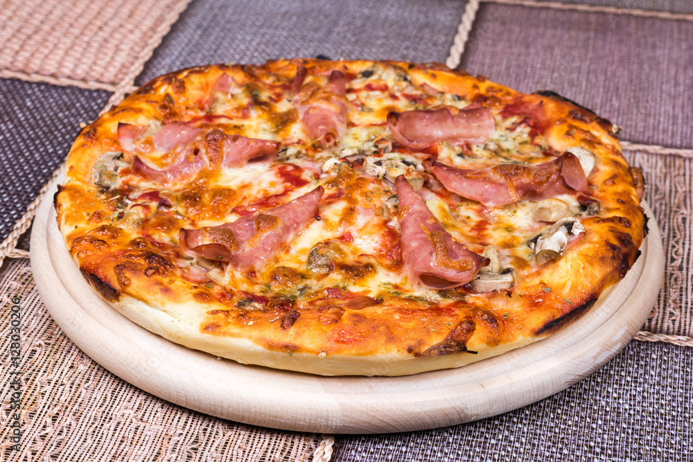 Delicious pizza with ham cheese mushrooms Delicious pizza with ham cheese mushrooms