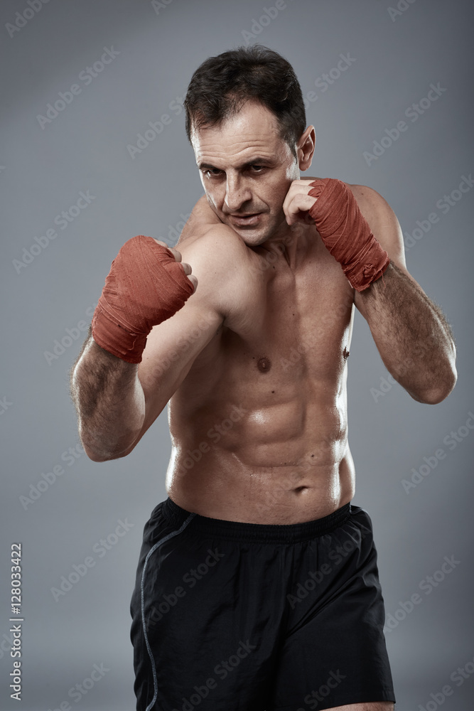 Kickbox fighter on gray background