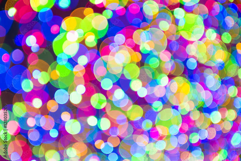 Holiday Christmas tree lights background in bright and colorful bokeh abstract