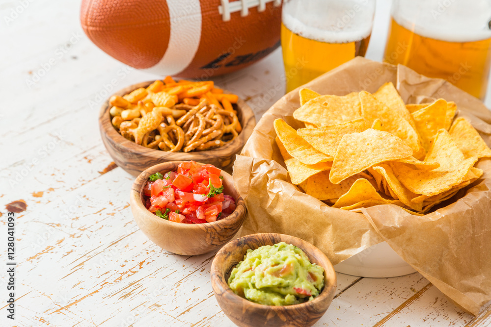 Football party food, super bowl day, nachos salsa guacamole Football party food, super bowl day, nachos salsa guacamole