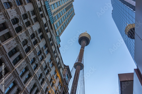 Photography Sydney's centrepoint tower and a skyscraper against a blue sky
