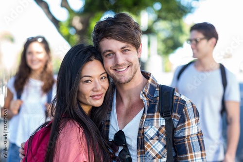 Hip couple posing for camera