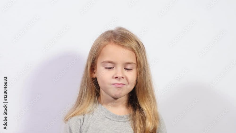 Charming girl thinking. Find ideas and solve problems. Close up girl grimacing on white background. Charming girl thinking. Find ideas and solve problems. Close up girl grimacing on white background.