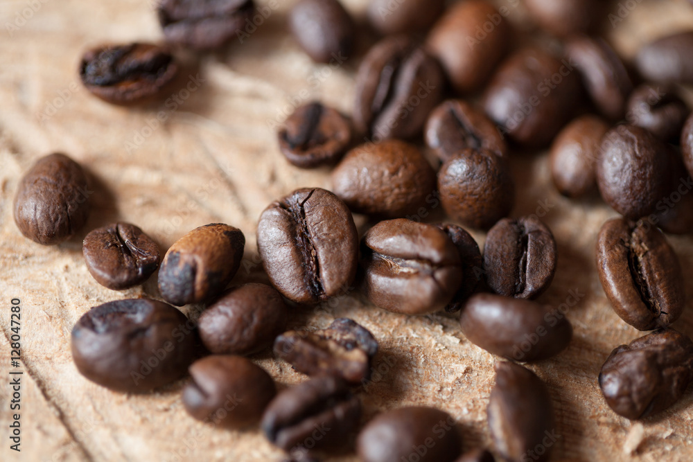 Closeup of coffee beans with focus on one Closeup of coffee beans with focus on one