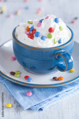 coffee with whipped cream and colorful chocolate drops