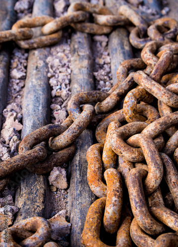 Rusty chain at construction site © Satakorn