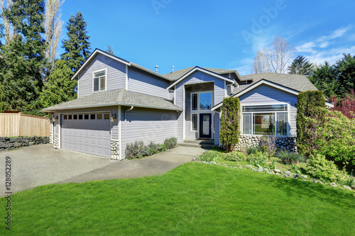 Traditional blue home exterior in Puyallup with wood siding