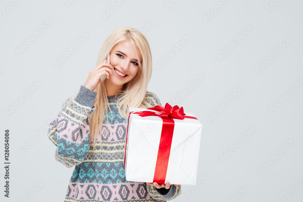 Model in sweater with gift Model in sweater with gift