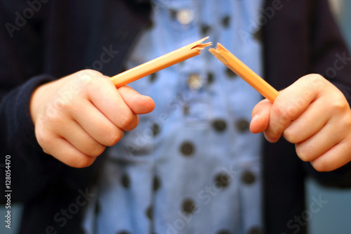 Photography The girl broke the pencil