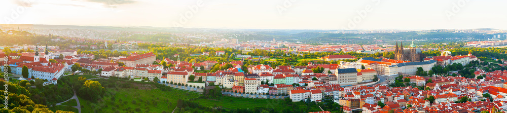 Panorama of the old part of Prague from the Petrin tower. Beautiful view on the Strahov monastery and Prague Castle at sunset. Old Town architecture, Czech Republic. Aerial view