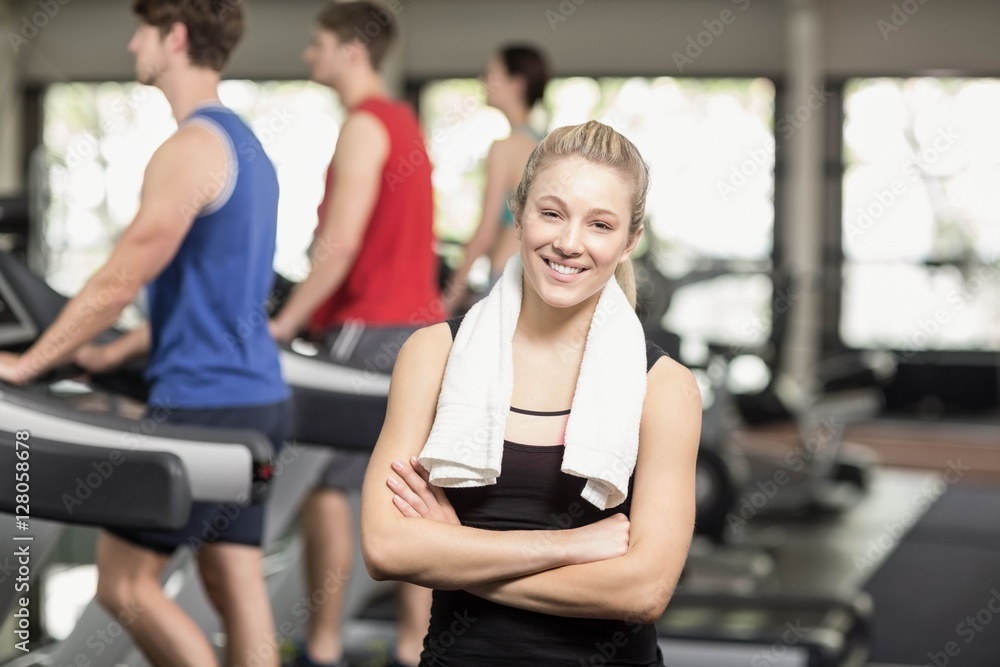 Fit woman posing with arms crossed