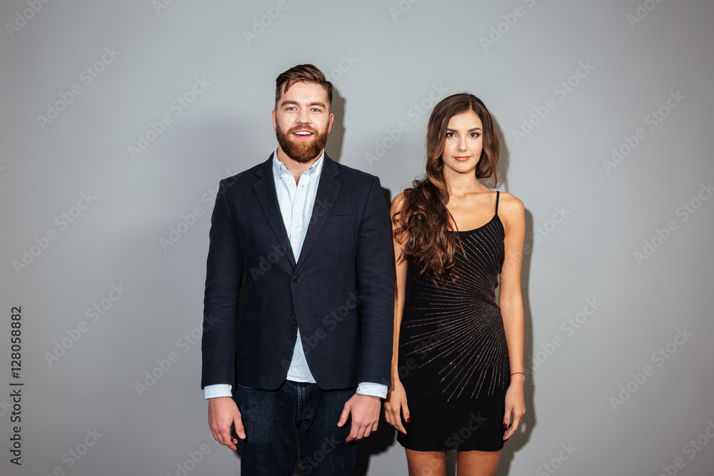 Handsome man in suit and attractive woman in black dress Handsome man in suit and attractive woman in black dress
