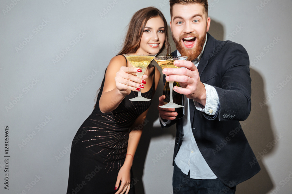 Friends with champagne looking at camera Friends with champagne looking at camera
