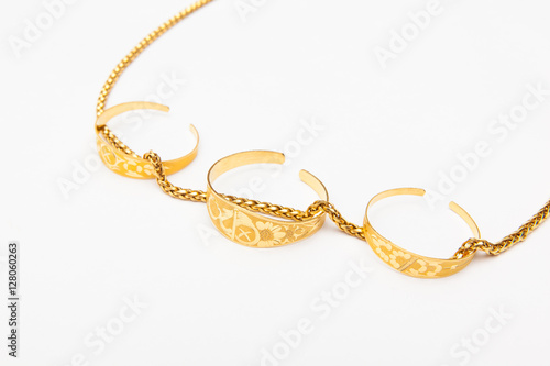 golden jewelry accessory on white backgrounds