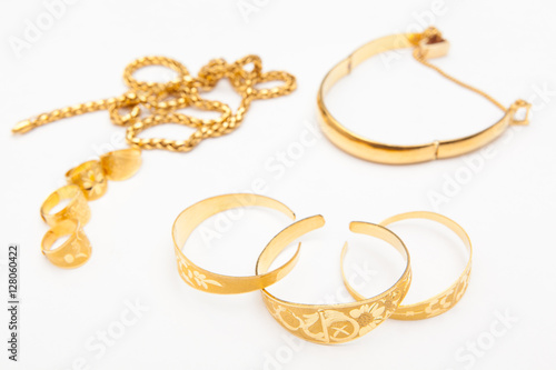 golden jewelry accessory on white backgrounds