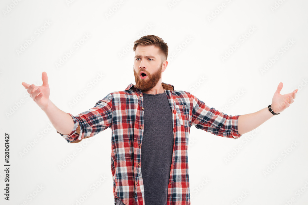 Confident bearded man in plaid shirt singing with arms raised Confident bearded man in plaid shirt singing with arms raised