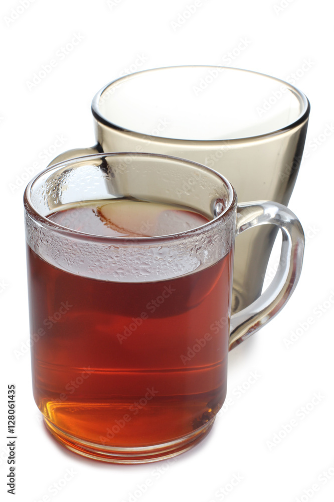 Glass cup with tea on white background Glass cup with tea on white background