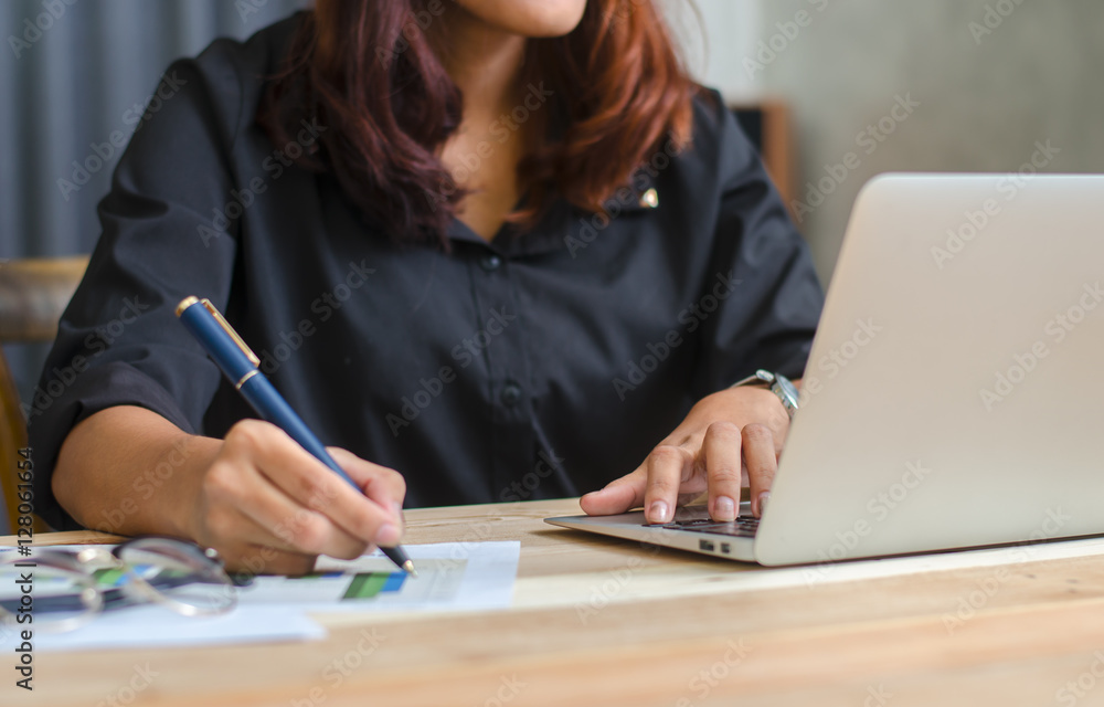 Close up of female accountant or banker making calculations. Sav Close up of female accountant or banker making calculations. Sav