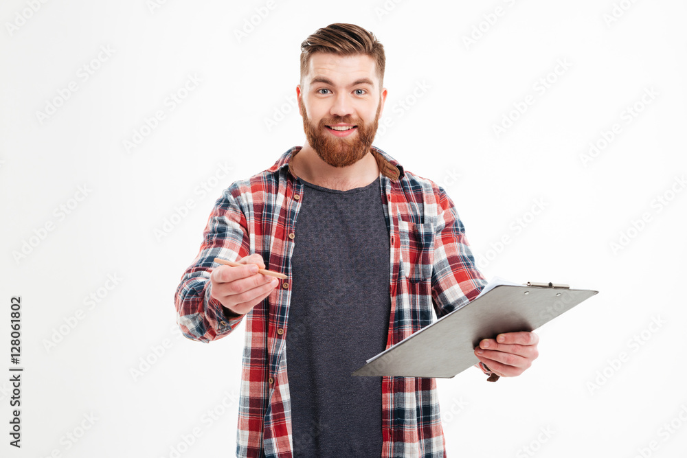 © Drobot Dean - Man in shirt holding clipboard and giving pencil to camera