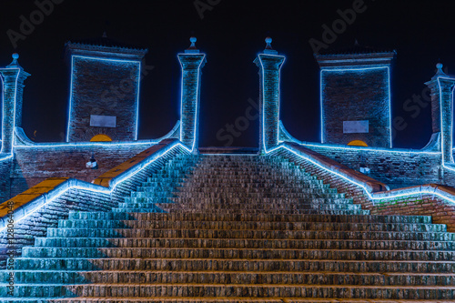 Christmas lights on ancient bridge photo