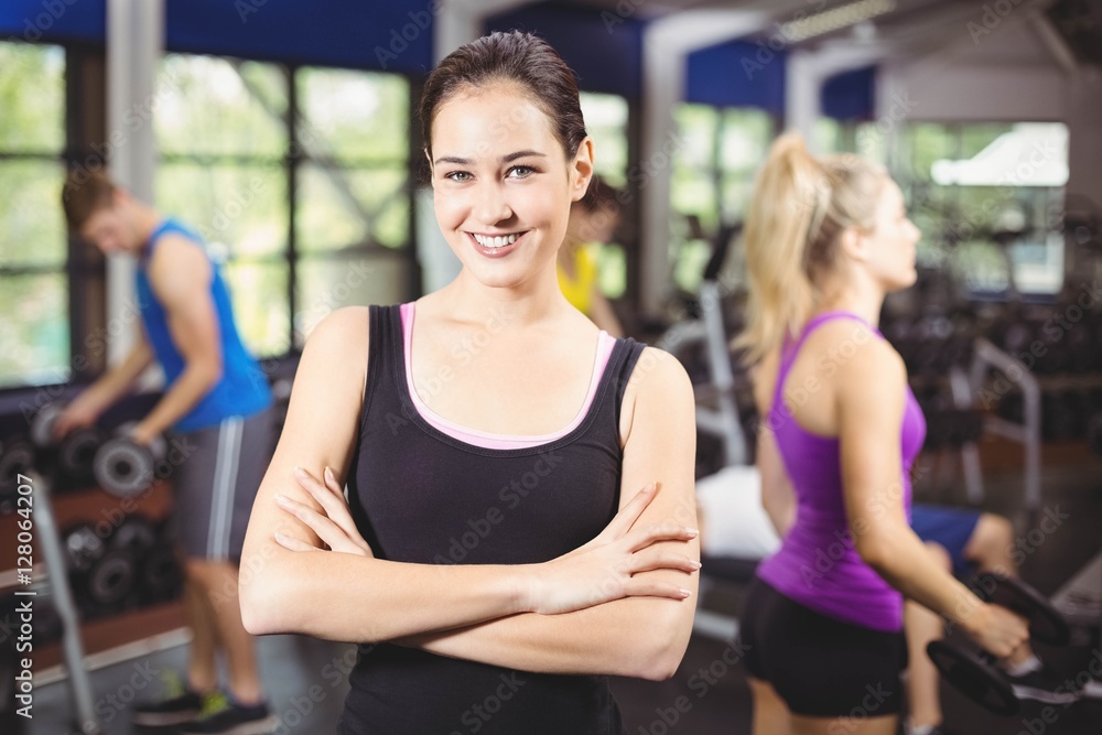 Smiling woman posing with arms crossed Smiling woman posing with arms crossed