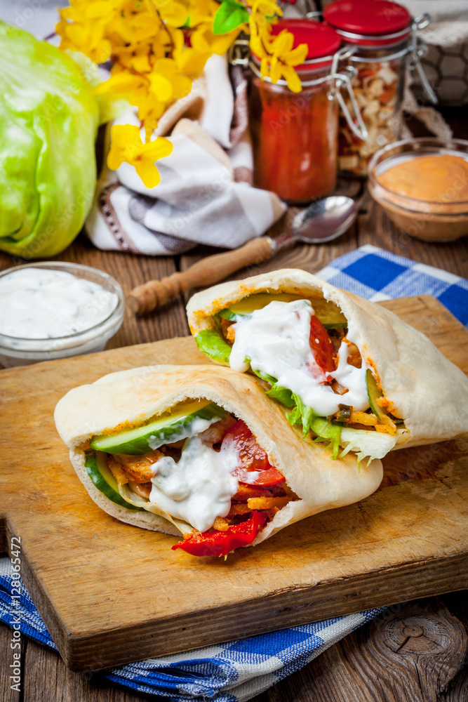 Fried chicken meat with vegetables in pita bread Fried chicken meat with vegetables in pita bread