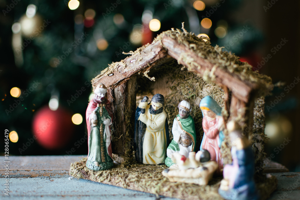 Christmas Manger scene with figurines including Jesus, Mary, Joseph, sheep and magi.