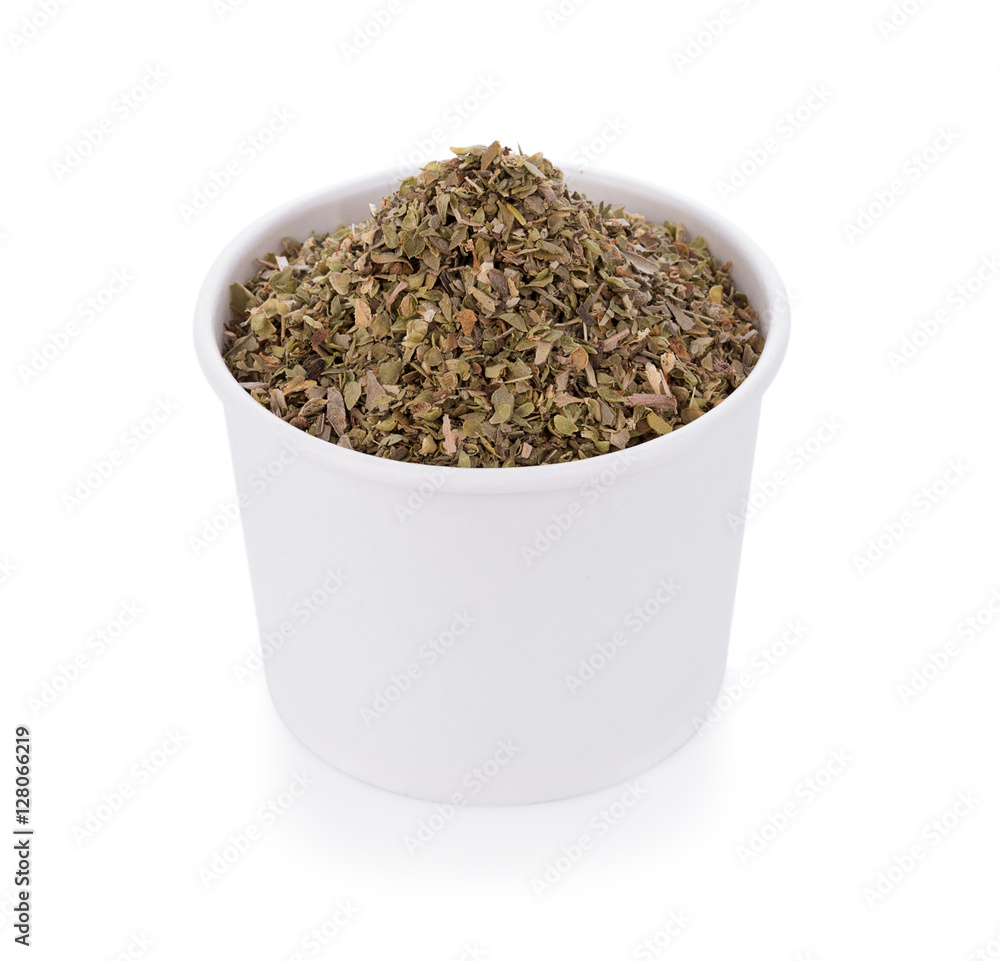 Dried Oregano on white bowl on white background Dried Oregano on white bowl on white background