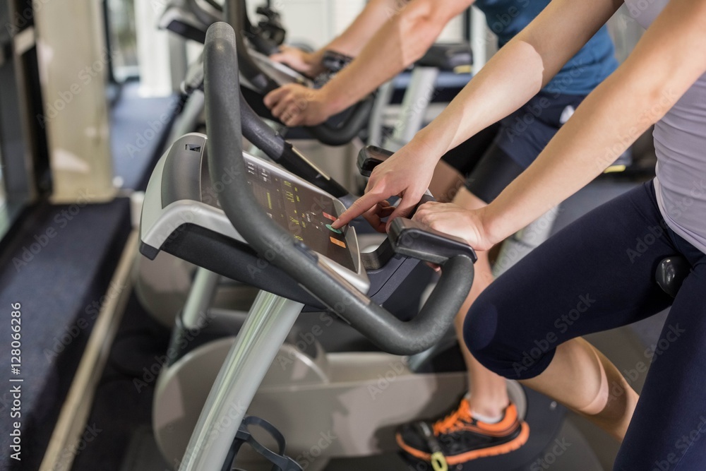 Fit people doing exercise bike Fit people doing exercise bike