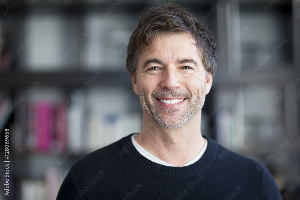 Portrait Of A Mature Man Smiling At The Camera. Home Portrait Of A Mature Man Smiling At The Camera. Home
