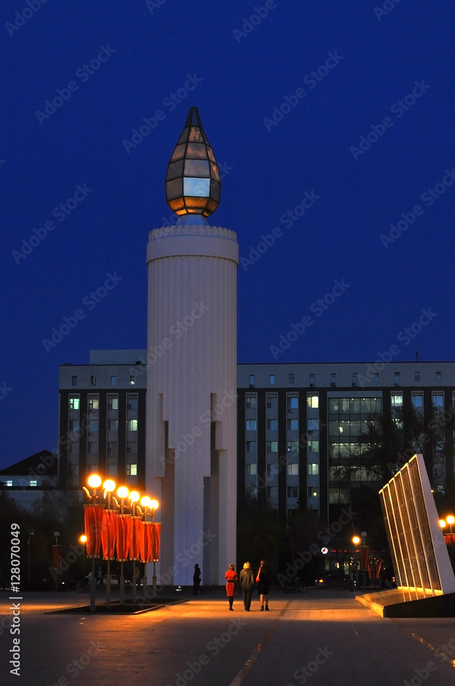 Fototapeta premium Candle and Steles with names of residents of Tyumen, to the sold