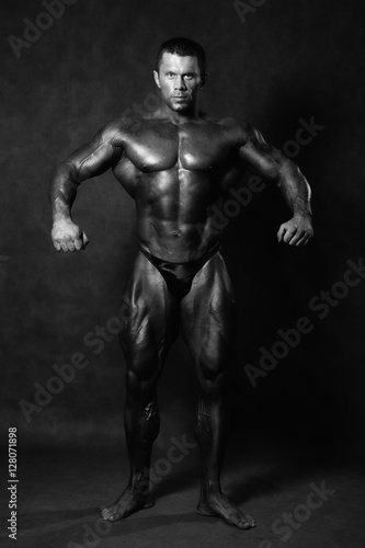 Muscular male Bodybuilder posing © kanzefar