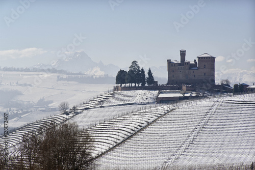 Fototapeta Naklejka Na Ścianę i Meble -  View of the Castle of Grinzane Cavour in winter with snow