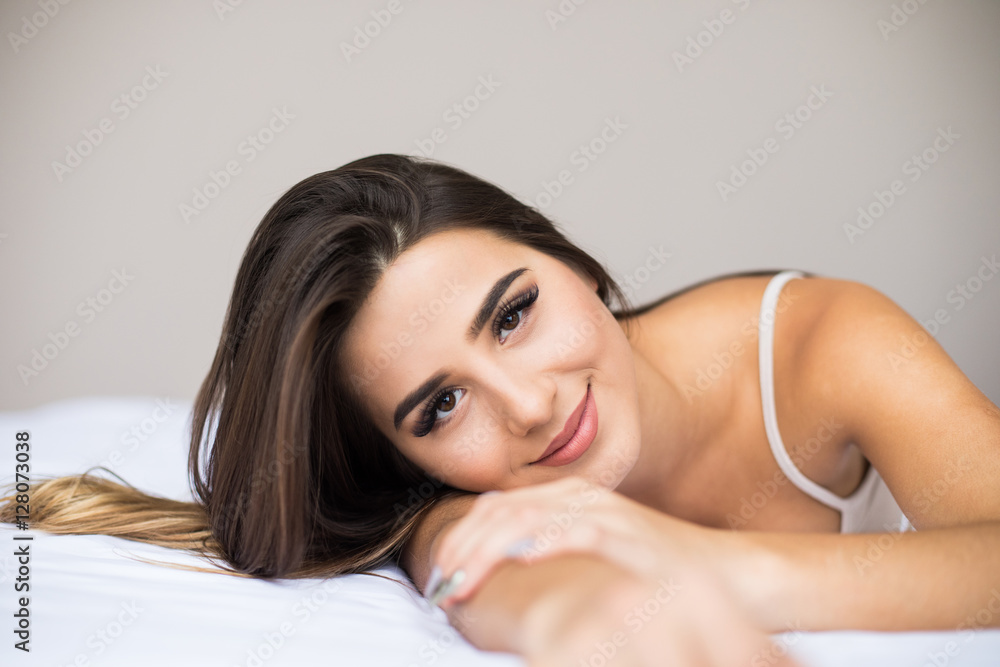 Young beauty woman lying in bed Young beauty woman lying in bed