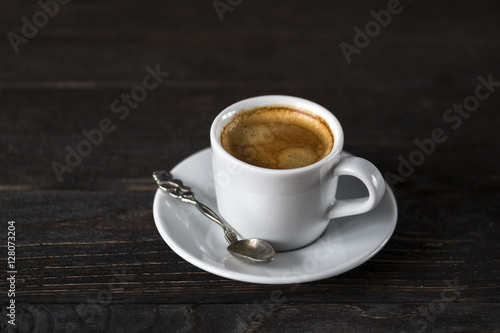 cup of aroma black espresso on wooden table