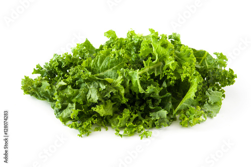 Fresh green superfood kale leaves isolated on white background
