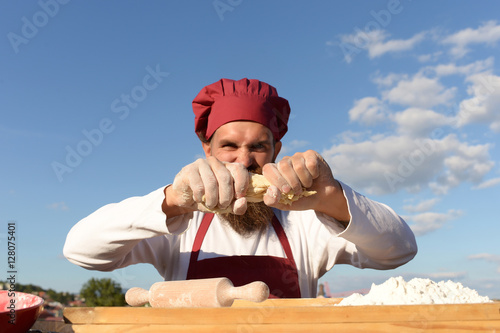 berded man chef cooking outdoor photo