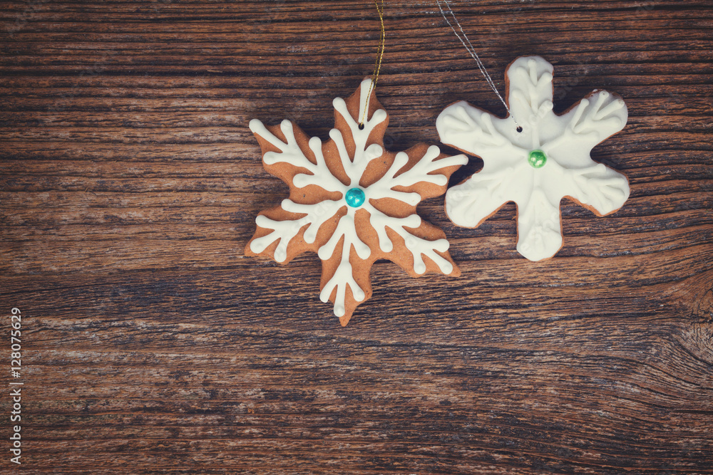 gingerbread christmas iced snowflakes cookies on wooden background, retro toned gingerbread christmas iced snowflakes cookies on wooden background, retro toned