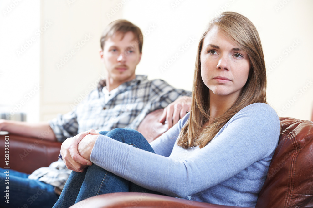 Couple With Relationship Difficulties Sitting On Sofa Couple With Relationship Difficulties Sitting On Sofa